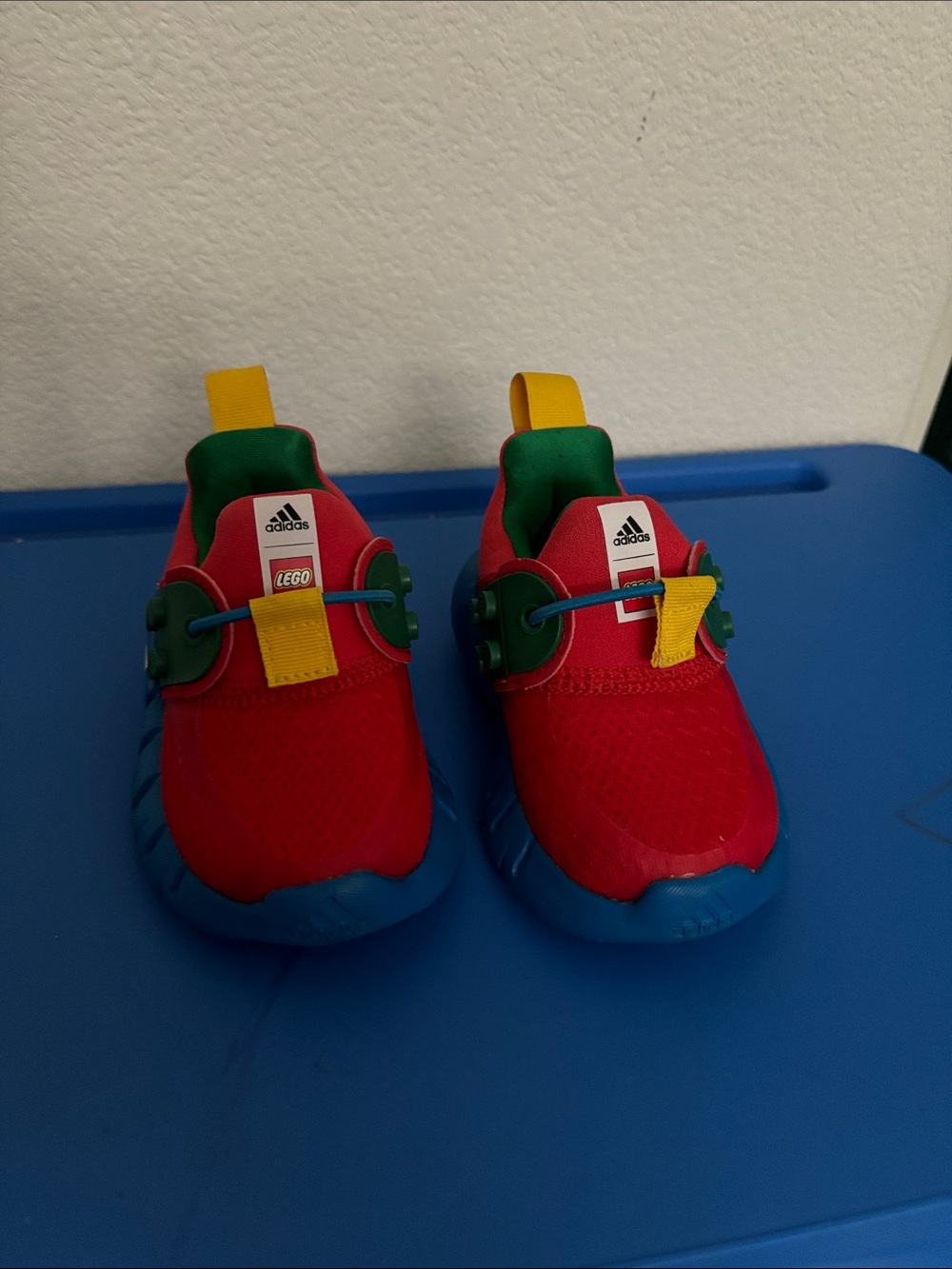adidas Kids Red LEGO Slip-On Sneakers with Blue Soles and Yellow Tabs